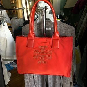 Tory Burch bag NWT some black marks on front .
